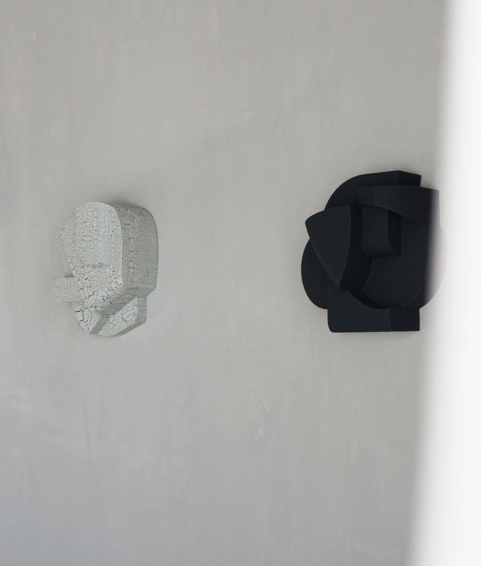 'Sand' wall sculptures with hand-painted finish, inspired by architectural forms.