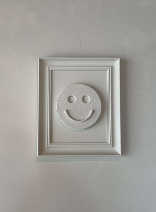 Vintage Frame Happy artwork in shadow white, featuring a smiley face, crafted by Edith Beurskens.