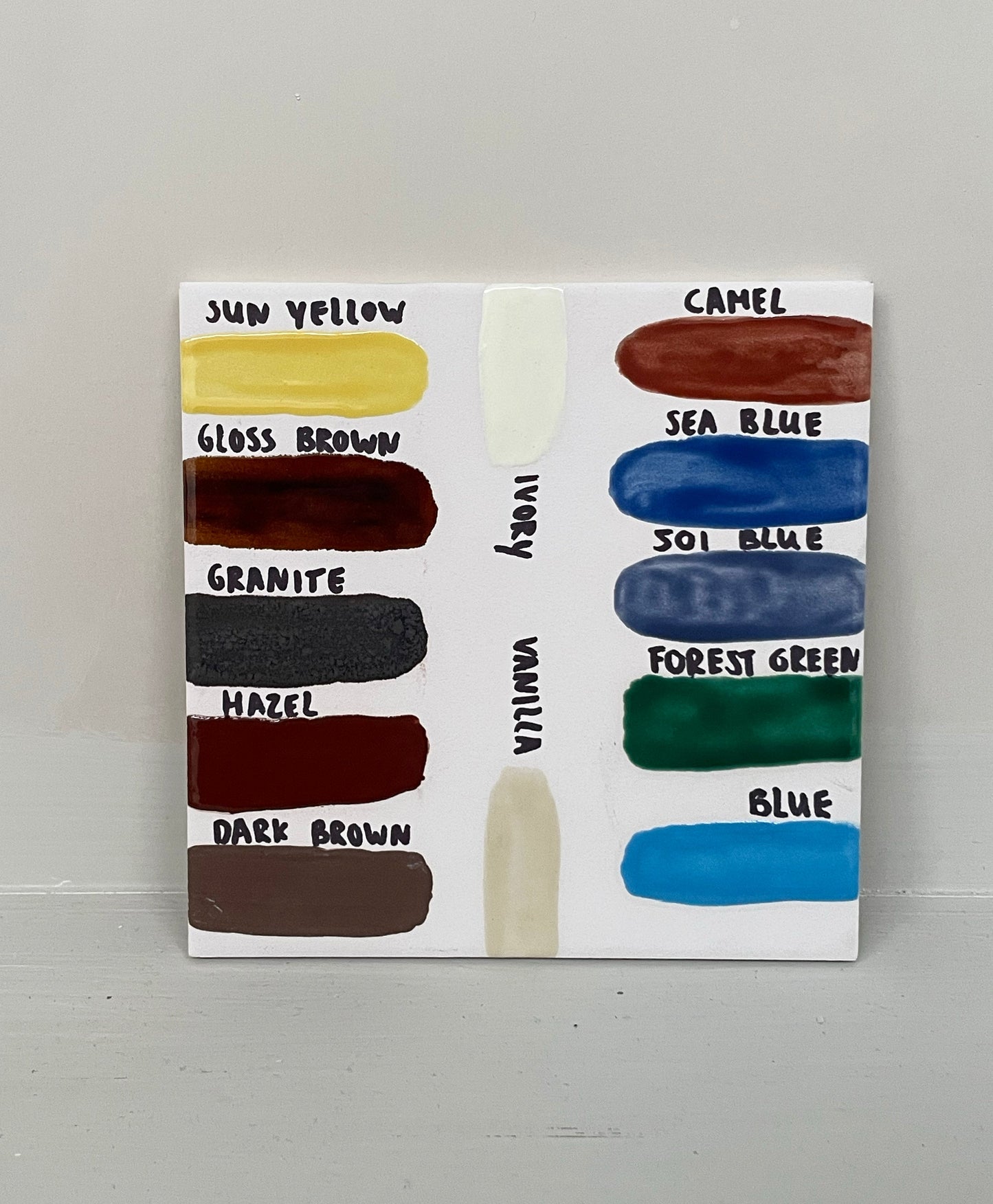 Color swatches for handbuilding and glazing workshop with labeled ceramic glaze samples.