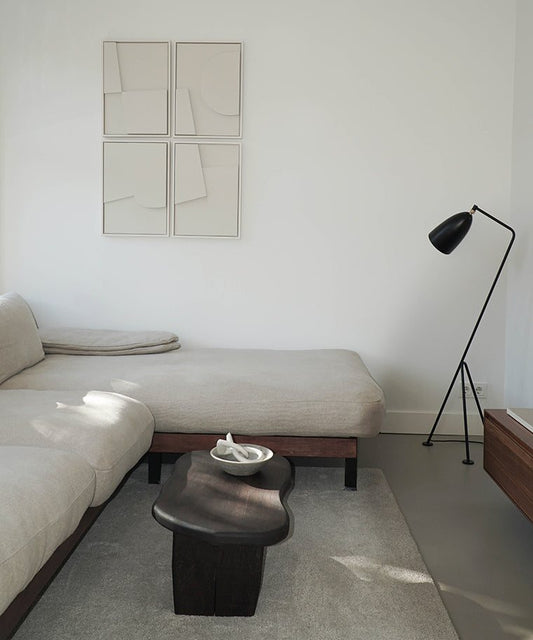 Handmade Quartet art pieces on wall in modern living room setting.