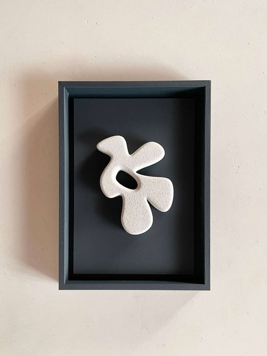 Archive artwork "#23.1 Bird" made from biodegradable PLA, finished with sand texture and eco-paint, displayed in a black frame.