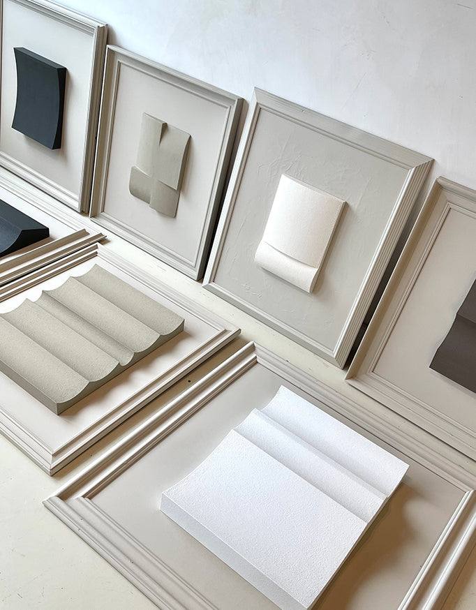 Vintage frame artworks by Edith Beurskens with sand texture and eco-paint, in mushroom and shadow white colors, 59 x 69 cm.