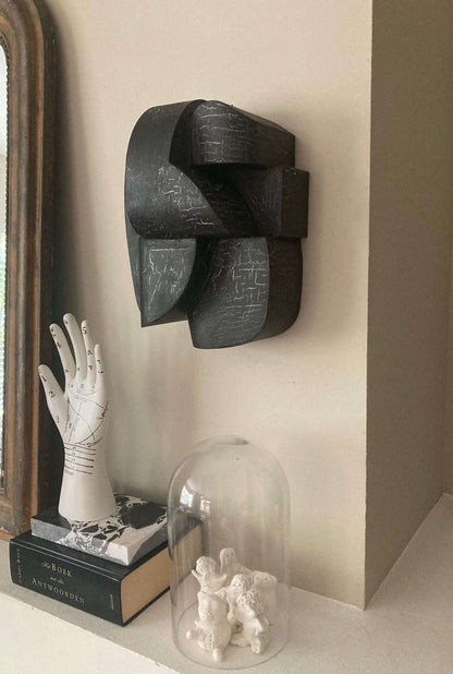 Organic "Ida" sculpture with crackle finish on a wall, showcasing unique hand-painted design.