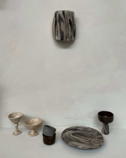 CERAMIC WORKSHOP creations including swirl plates and cups.