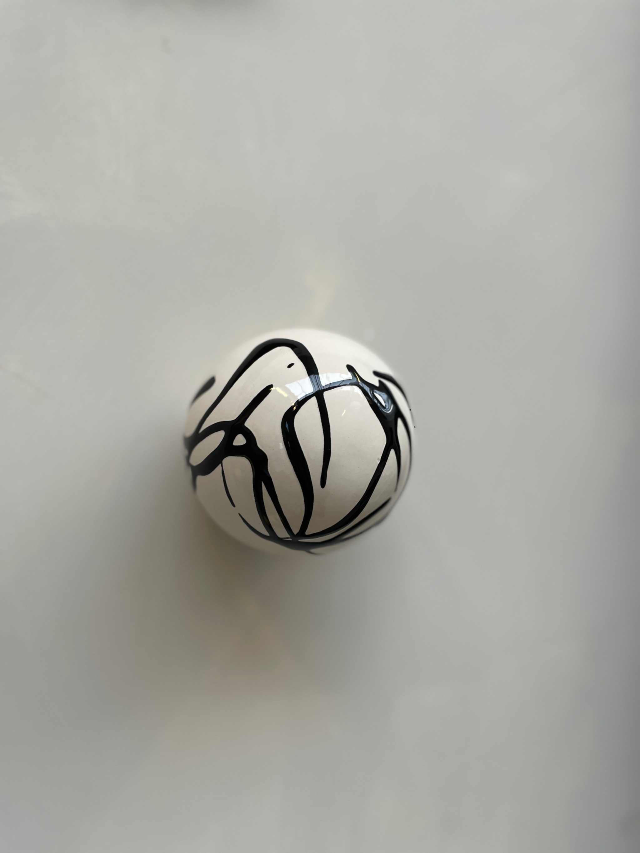 Handcrafted ceramic ball with artsy swirl, wall sculpture by Edith Beurskens and April van Domburg.