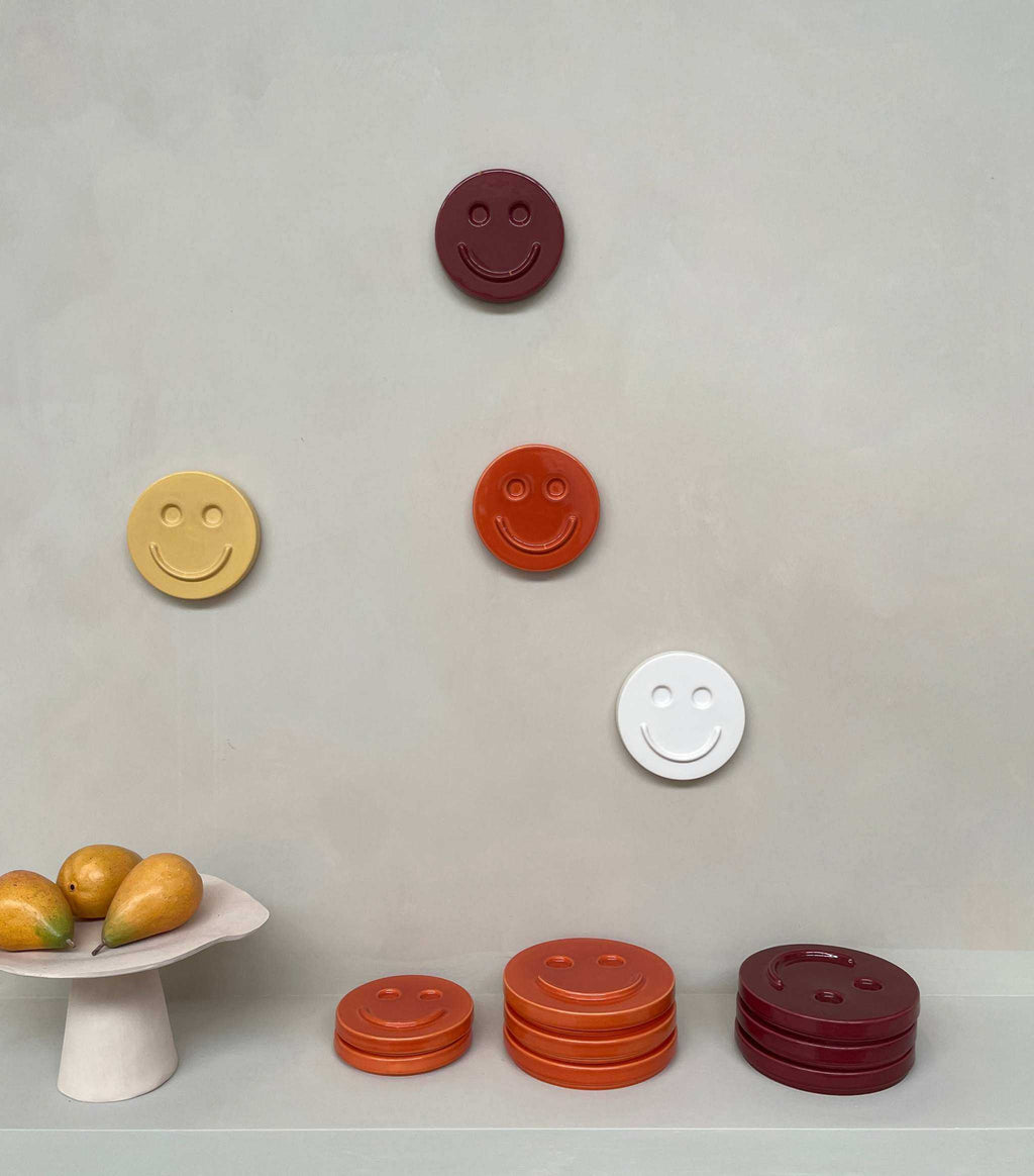 white ceramic wall art smiley face hanging on wall handcrafted decorative piece