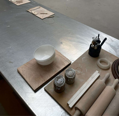 CERAMIC WORKSHOP for Beginners setup with clay tools and materials.