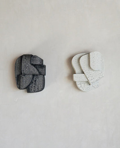Hand-painted 'Ko' wall sculpture with crackle finish in black and white, organic architectural form, 30x24.5x14.9 cm.