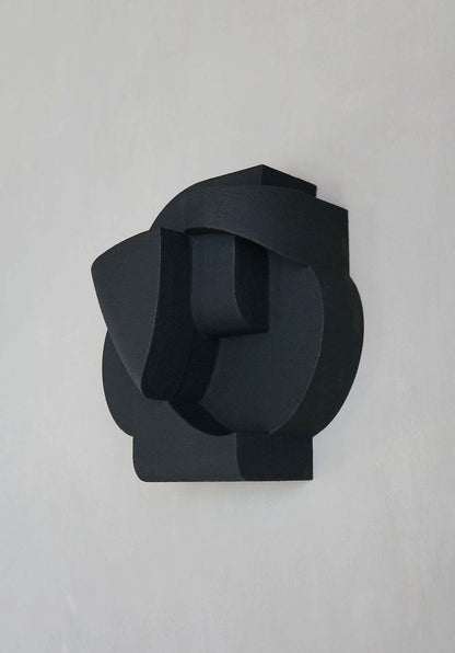 Organic black wall sculpture with cubist design, "Jane" by Ilse van Stoltz and Edith Beurskens.