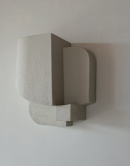 'Sculpture' wall art in organic form with hand-painted sand finish.