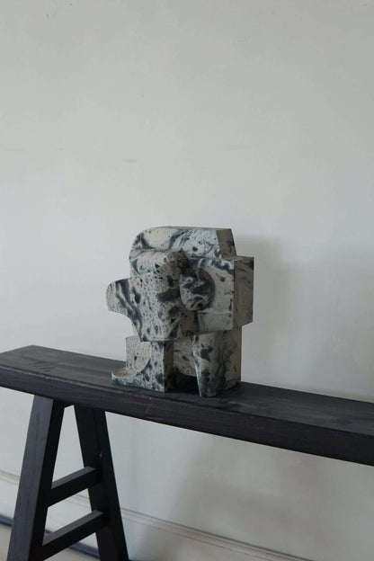 Mien Sculpture Small Marble effect wall piece with hand-painted finish on display.
