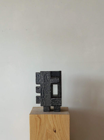 Odile Sculpture with crackle finish on display pedestal.