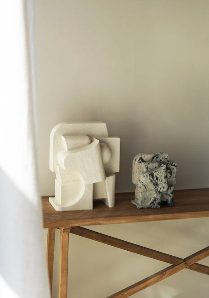 Mien Sculpture with hand-painted finish on wooden table.