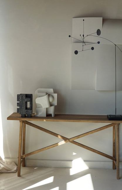 Mien Sculpture in organic form with hand-painted finish, displayed on a wooden table.