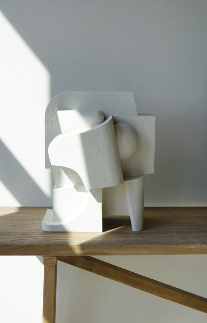 Large organic 'Mien' sculpture with crackle finish on wooden surface.