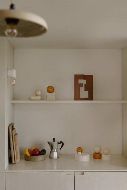 Ceramic box 'BOULE' in cognac and vanilla on kitchen shelf, handmade storage solution.