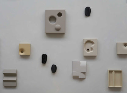 Petanque artwork made from eco-friendly materials, featuring a brown wood design with unique geometric patterns.