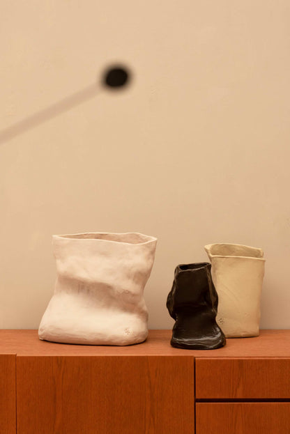 Handcrafted unique ceramic vase object 02 set in white, black, and beige, displayed on wooden surface against neutral background.