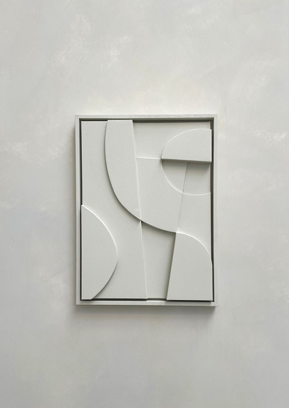 Minimalist abstract canvas print with geometric shapes in a white frame.