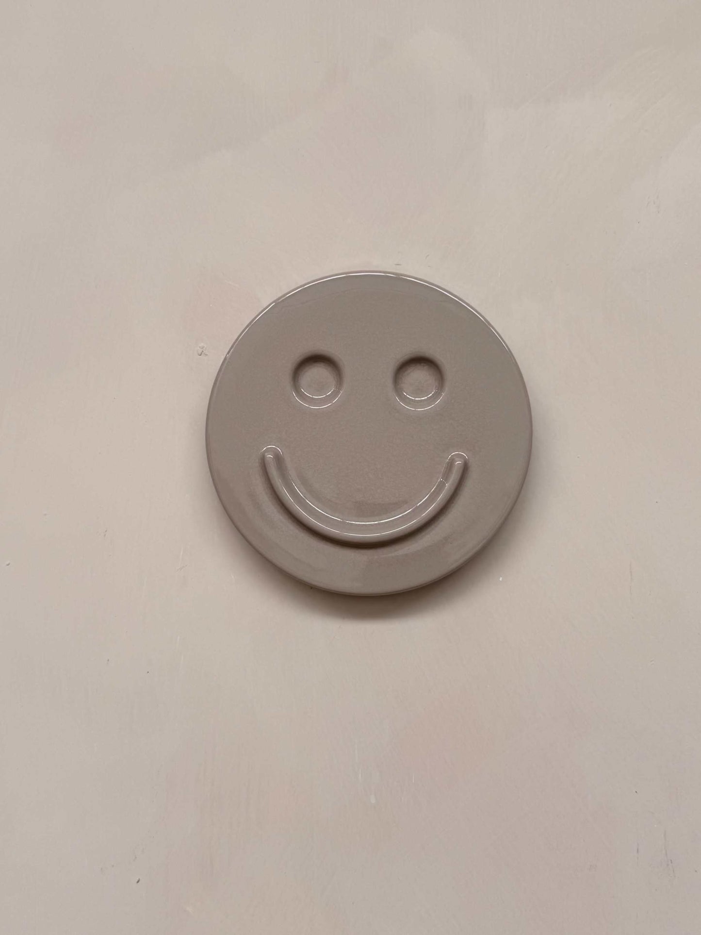HAPPY ceramic wall art smiley face made of concrete minimalist design