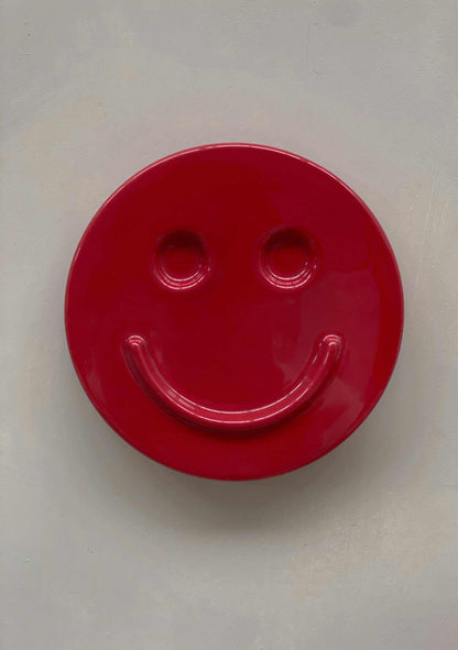 red ceramic HAPPY smiley face wall art by Edith Beurskens designed at Royal Goedewaagen