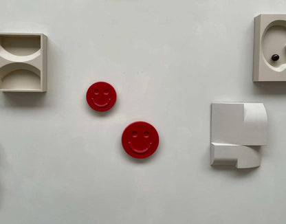 HAPPY ceramic wall art red radish smiley faces handcrafted decorative pieces on white wall