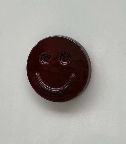 Eggplant SMILE ceramic artwork by Edith Beurskens, handcrafted and glazed, available for pre-order.