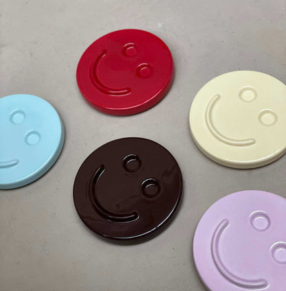 HAPPY ceramic wall art colorful smiley face ceramic discs handcrafted by Edith Beurskens