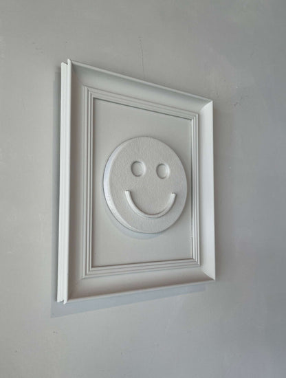Vintage Frame Happy artwork by Edith Beurskens, featuring a shadow white smiley face design in a vintage frame.