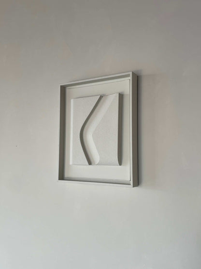 Canvas Erosian wall artwork with shadow white frame and structured plaster finish.