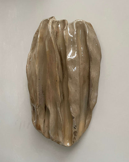 Ceramic sculpture "OBJETS DE NOYER - SAND 01" showcasing organic walnut-inspired shapes and eclectic colors, size 30 x 19 cm.