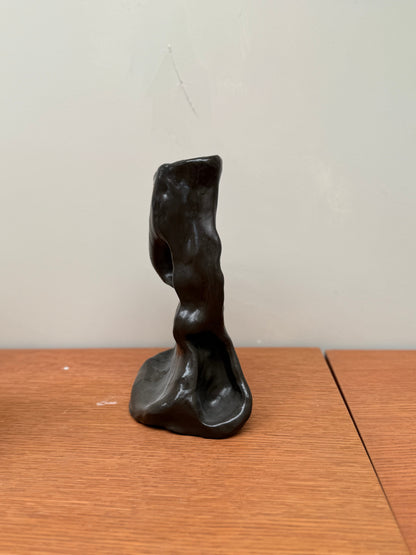 Handcrafted unique black ceramic vase object 02 with organic abstract shape on wooden surface