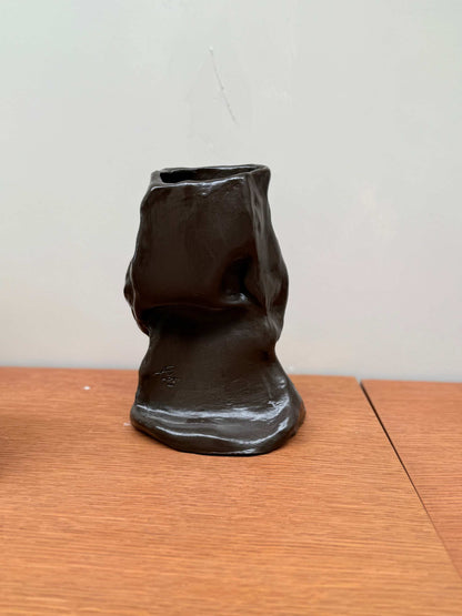 Black handcrafted ceramic vase object 02 with unique organic shape on wooden surface
