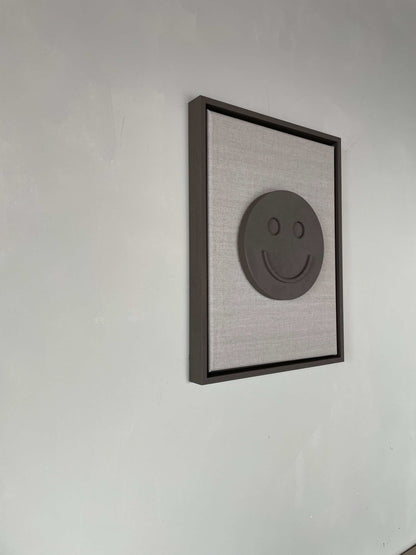 Canvas Happy artwork on a biodegradable PLA base with a smiley design in a structured plaster finish, framed, 43 x 33.5 cm.