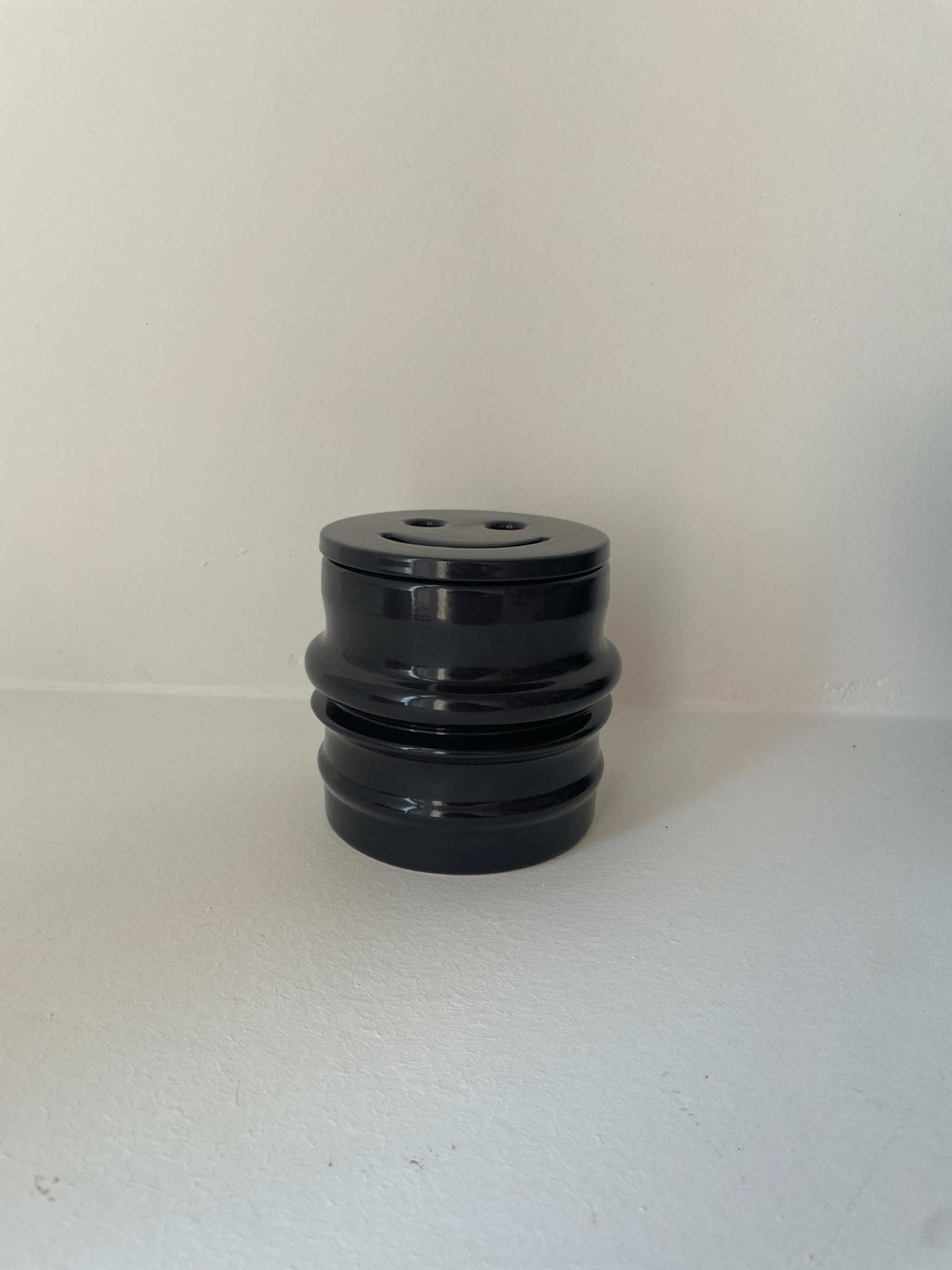 Ceramic candle holder in petrol color from Shape 03 Collection.