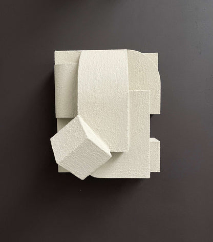 Erica wall sculpture in sand color with organic cubist design and hand-painted finish.