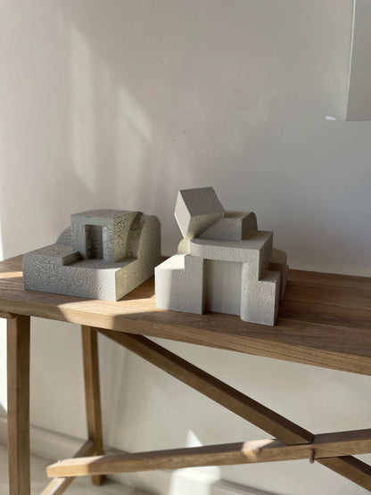 Erica Sculpture Sand with organic form and hand-painted finish on a wooden table.