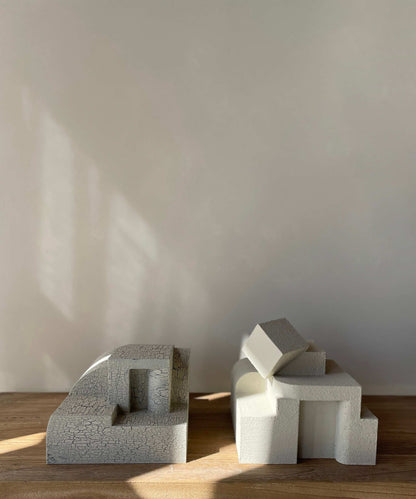 Erica Sculpture Sand with hand-painted finish displaying organic form on a wooden surface.