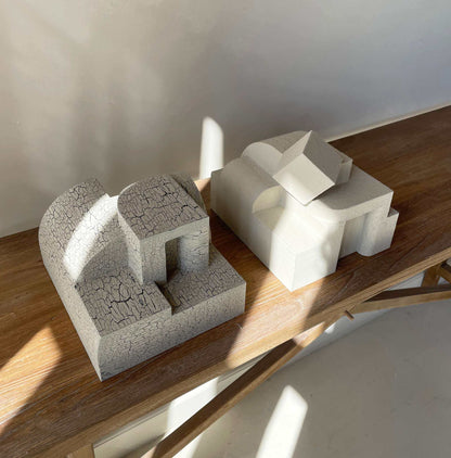 Erica Sculpture in Sand finish, organic form with hand-painted design, on a wooden surface.