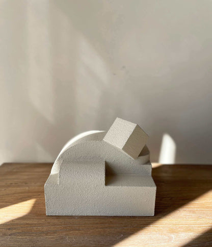 Erica Sculpture Sand with organic form and hand-painted finish on a wooden surface.