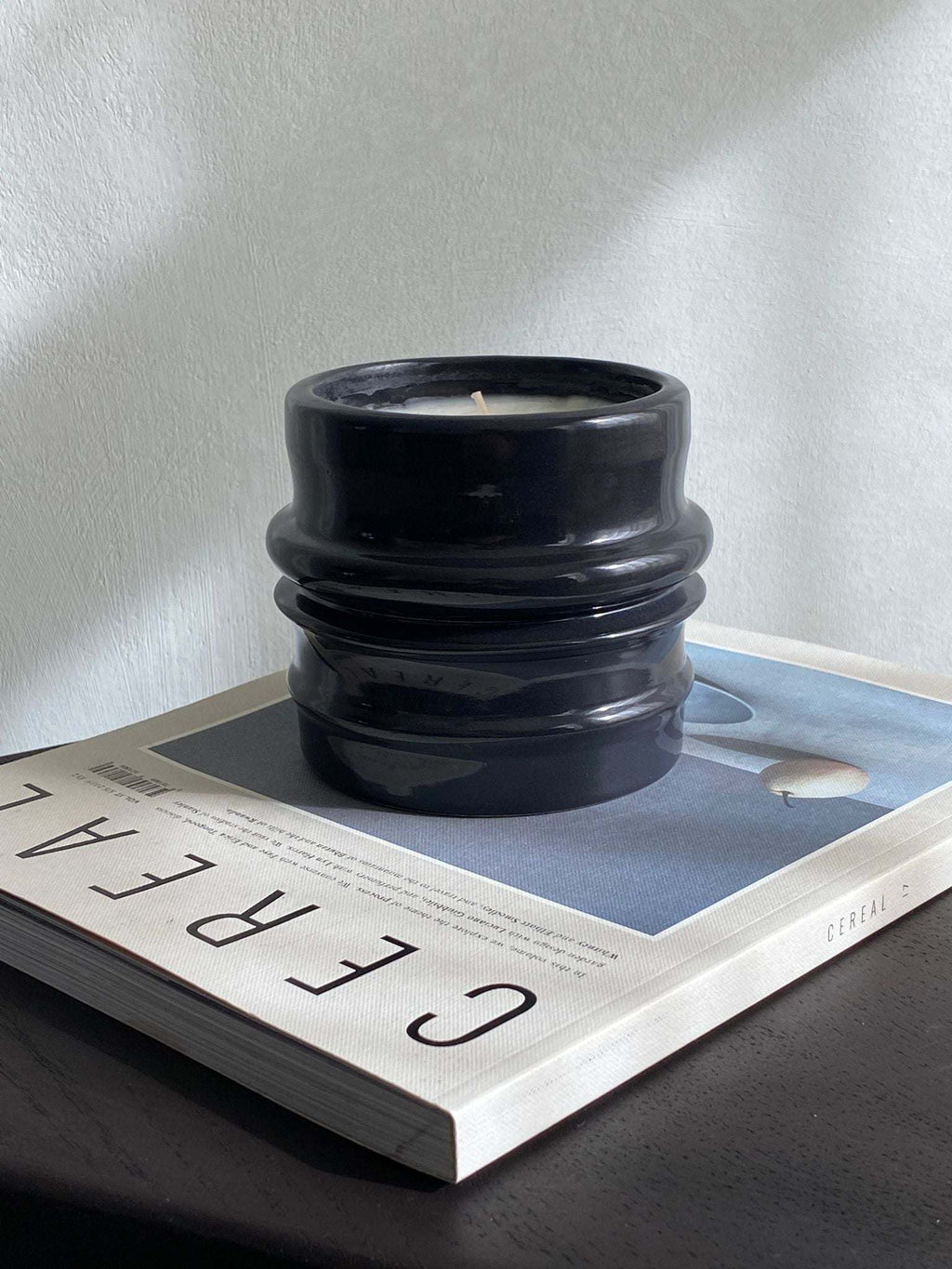 Black ceramic scented candle holder from Shape 03, hand-crafted for the Shapes Collection.