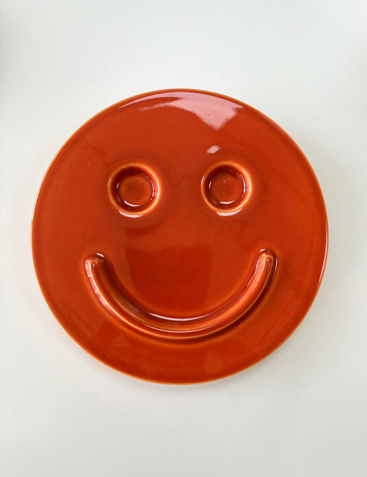 Red 'HAPPY' ceramic artwork