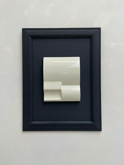 Vintage Frame Nova with gloss off-white artwork in black vintage frame, 70.5 x 52.5 cm.