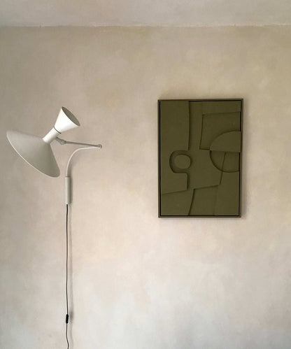 Minimalist wall art titled "20.8 Ebe" with sand texture finish and eco-paint, displayed beside a modern wall lamp.
