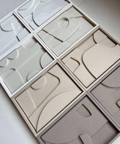 Hand-made abstract art pieces made from biodegradable PLA with sand texture and eco-paint.