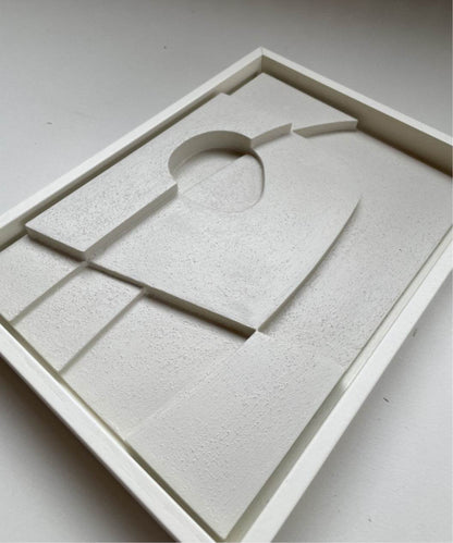 Handmade abstract art piece, Alfie #21.12, in white frame, made from biodegradable PLA with sand texture finish.