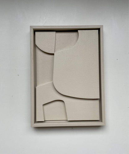 Hand-made art piece in beige tones with abstract geometric design, framed and textured surface.