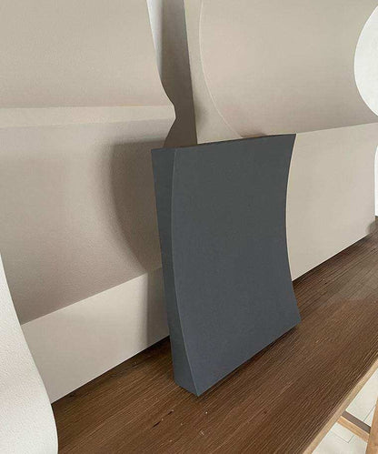 Handmade 22.06 Folding art piece with sand texture on a wooden surface.