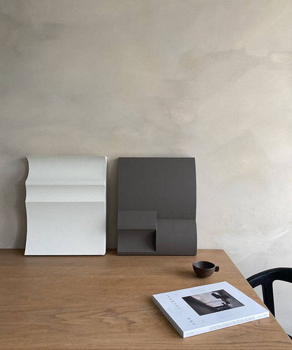 Handmade #22.01 Ark art pieces on wooden table with certificate and cup.