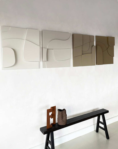 Modular plant-based 3D art panels in neutral tones on a wall, handcrafted with sand texture.